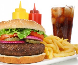 Hamburger meal served with french fries and soda close-up